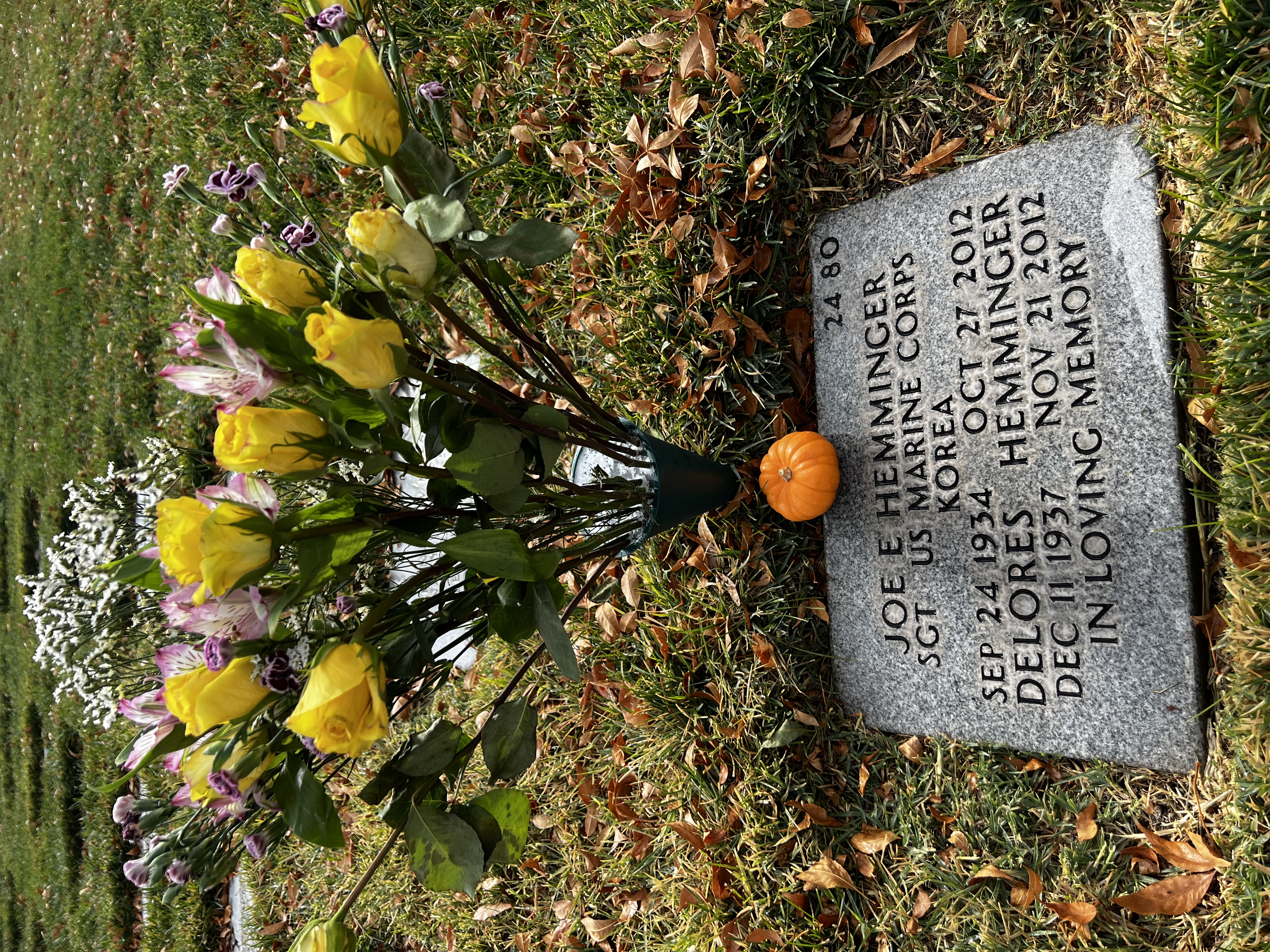 Gravesite care with yellow roses